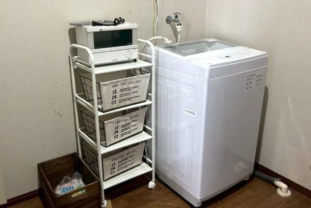 リゾートバイトの個室寮のきゅお用洗濯機の画像。
