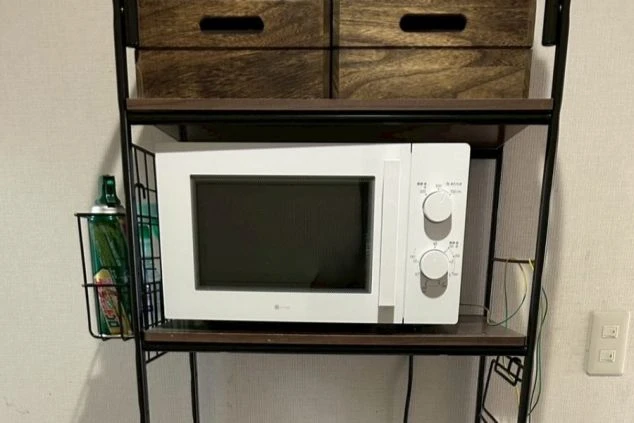 リゾートバイトの個室寮の共用洗濯機の画像。