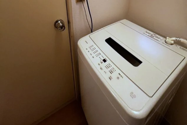 リゾートバイトの完全個室寮の洗濯機の画像
